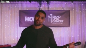 Marcus Bronzy Presenting at the hook x stand up to cancer