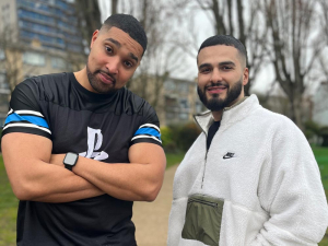 Marcus and Kae Standing in park smiling at the camera